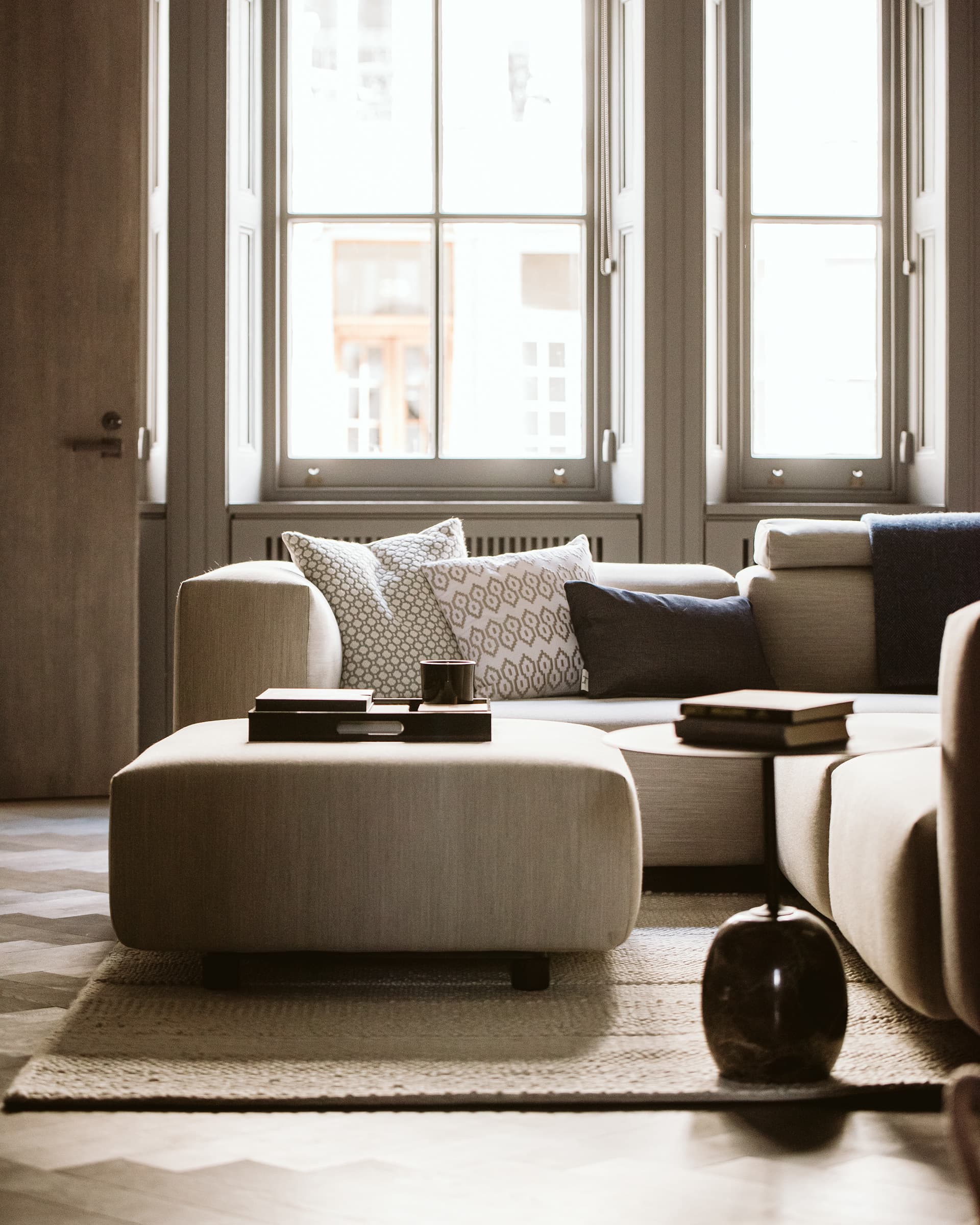 Calm London sitting room with sash windows, kept well-presented throughout
