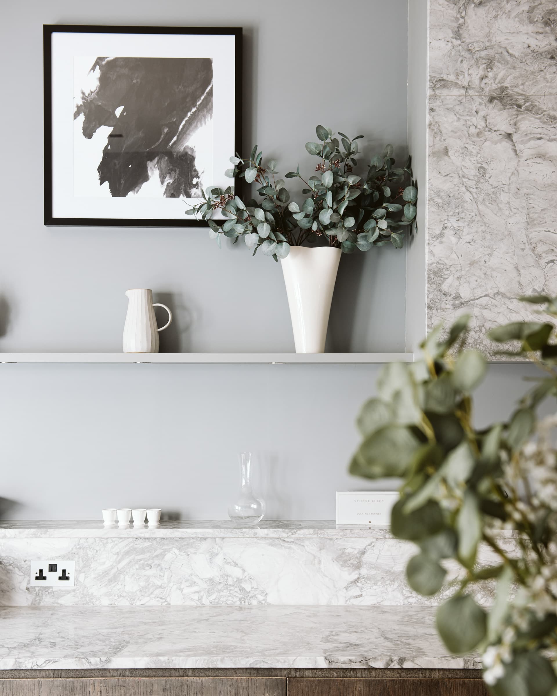Marble kitchen surface with eucalyptus — a London property kept in immaculate condition